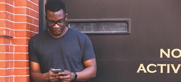 A man looking at a phone.