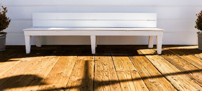 wooden roof deck with a bench