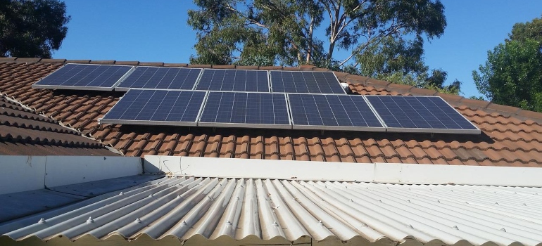 Several solar panels on a roof.