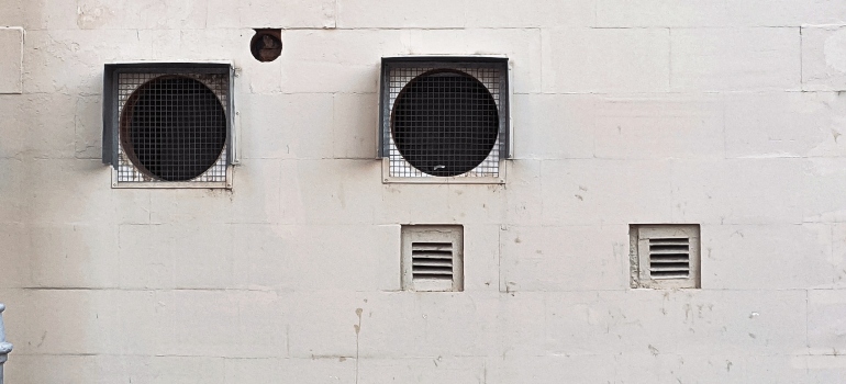 Wire-meshed openings in the wall.