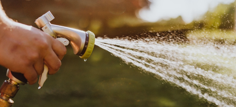 a person holding a hose