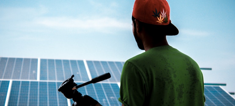 A person looking at solar panels