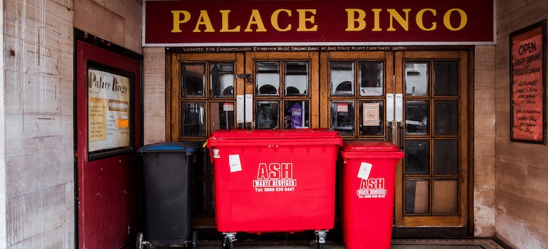 Trash cans in front of the bingo place