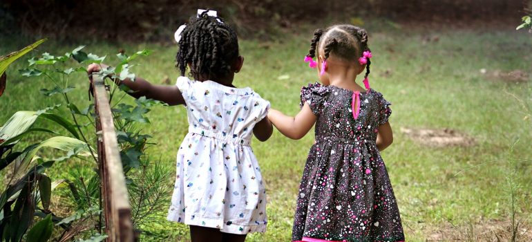 Two girls playing outside.