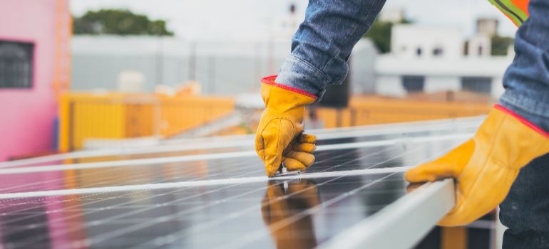 man installing solar panels