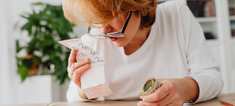 A woman looking at the utility bill