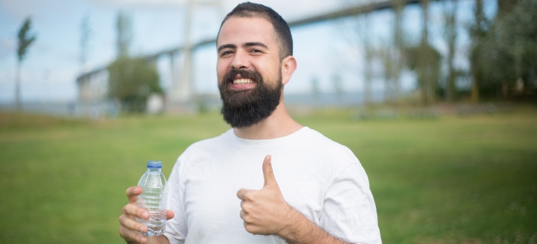 man happy because he made a choice pigeon trapping vs. pigeon deterrents