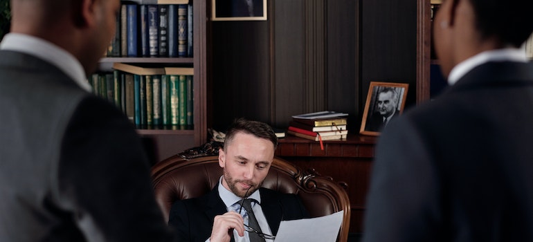 Lawer in the office reading about pigeon removal and the law