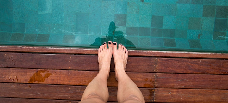 A person standing by the pool